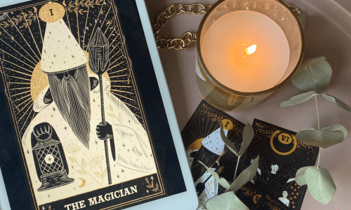 A magical book along with a glass candle